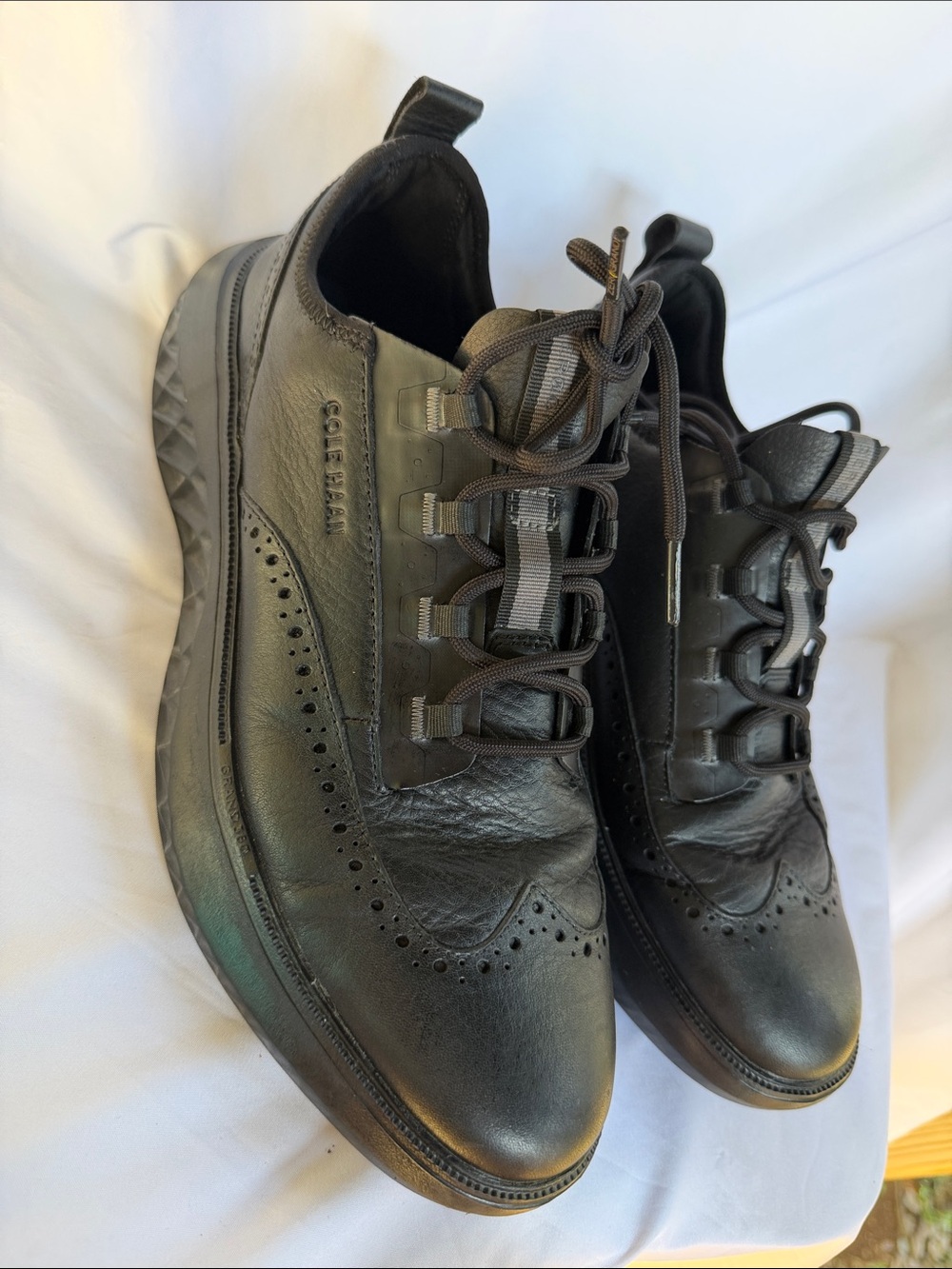 Cole Haan Black Leather Wingtip-Style Slip-On Sneakers